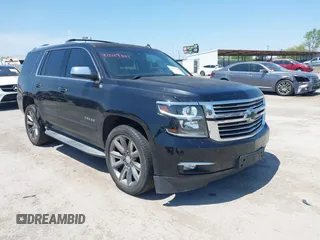 2015 Chevrolet Tahoe LTZ z VIN 1GNSCCKC4FR309152, wystawiony jako IAAI lot #42029341 z przebiegiem 187 313 mil mil oraz . Historia ofert i sprzedaży dostępna na DreamBid. Obrazek 1.