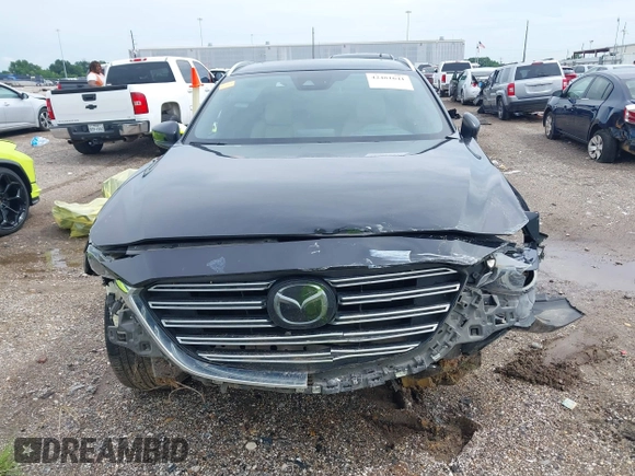 2018 Mazda CX-9 Grand Touring with VIN JM3TCADY3J0228643, listed as a IAAI auction lot 42481641 with 121,714 mi miles and . Bid and sale history available at DreamBid. Image 12.