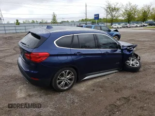 2018 BMW X1 xDrive28i with VIN WBXHT3C35J5F88893, listed as a Copart auction lot 58032725 with 143,968 mi miles and Salvage title. Bid and sale history available at DreamBid. Image 3.