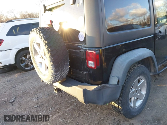 2011 Jeep Wrangler Rubicon with VIN 1J4HA6D11BL564211, listed as a IAAI auction lot 41242240 with 124,039 mi miles and . Bid and sale history available at carsss.com. Image 6.
