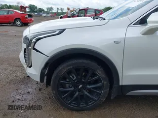 2022 Cadillac XT4 AWD Premium Luxury z VIN 1GYFZDR42NF128199, wystawiony jako IAAI lot #42522314 z przebiegiem 29 002 mil mil oraz . Historia ofert i sprzedaży dostępna na DreamBid. Obrazek 17.