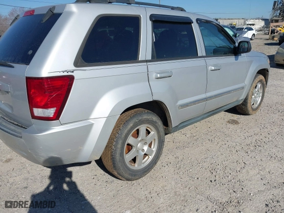 2010 Jeep Grand Cherokee Laredo with VIN 1J4PS4GKXAC103153, listed as a IAAI auction lot 41760743 with 185,138 mi miles. Bid and sale history available at carsss.com. Image 4.