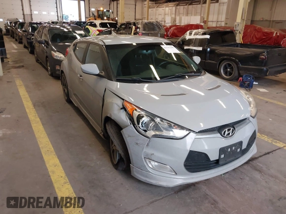 2013 Hyundai Veloster w/Black Int with VIN KMHTC6AD2DU128534, listed as a IAAI auction lot 41791398 with 158,414 mi miles and . Bid and sale history available at DreamBid. Image 1.