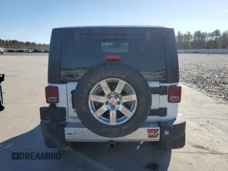 2014 Jeep Wrangler Sahara with VIN 1C4AJWBGXEL125544, listed as a Copart auction lot 51961845 with 146,917 mi miles and Salvage title. Bid and sale history available at DreamBid. Image 6.