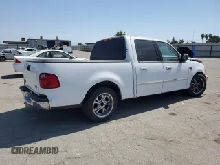 2001 Ford F-150 XLT with VIN 1FTRW07651KC49772, listed as a Copart auction lot 59904815 with 145,639 mi miles and Salvage title. Bid and sale history available at DreamBid. Image 3.