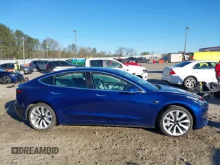 2019 Tesla Model 3 Long Range with VIN 5YJ3E1EB7KF454636, listed as a IAAI auction lot 41853972 with 56,916 mi miles. Bid and sale history available at carsss.com. Image 14.