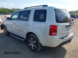 2013 Honda Pilot Touring with VIN 5FNYF3H92DB034731, listed as a IAAI auction lot 42049853 with 127,278 mi miles and . Bid and sale history available at DreamBid. Image 3.