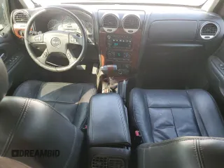2005 GMC Envoy SLT with VIN 1GKDS13S952382088, listed as a Copart auction lot 64765154 with 177,333 mi miles and Salvage Title. Bid and sale history available at carsss.com. Image 8.