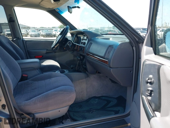 1996 Jeep Grand Cherokee with VIN 1J4EZ58S5TC149533, listed as a IAAI auction lot 42456529 with 173,872 mi miles and . Bid and sale history available at DreamBid. Image 5.