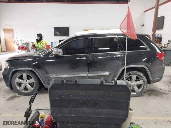 2011 Jeep Grand Cherokee Overland with VIN 1J4RR6GTXBC701186, listed as a IAAI auction lot 41553697 with 172,317 mi miles. Bid and sale history available at carsss.com. Image 14.