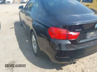 2014 BMW 4 Series 428i xDrive with VIN WBA3N5C52EF716998, listed as a IAAI auction lot 42548467 with 212,418 mi miles and . Bid and sale history available at DreamBid. Image 3.