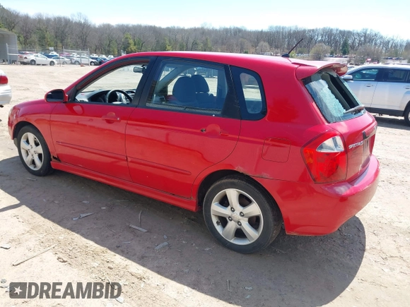 2009 Kia Spectra with VIN KNAFE241995024997, listed as a IAAI auction lot 42095812 with 217,555 mi miles. Bid and sale history available at carsss.com. Image 3.