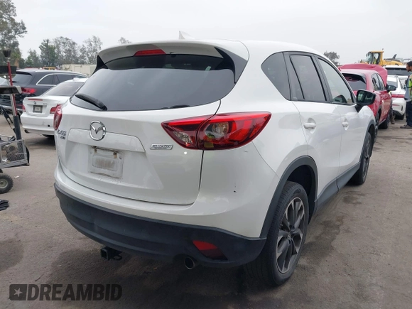 2016 Mazda CX-5 Grand Touring with VIN JM3KE4DY7G0737232, listed as a IAAI auction lot 42158279 with Not Provided miles and . Bid and sale history available at DreamBid. Image 4.