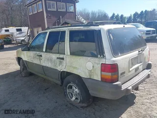1996 Jeep Grand Cherokee Laredo with VIN 1J4GZ58Y7TC381600, listed as a IAAI auction lot 42065681 with 1 mi miles. Bid and sale history available at carsss.com. Image 3.