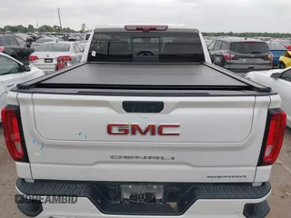 2022 GMC Sierra 1500 Denali with VIN 3GTU9FELXNG127029, listed as a IAAI auction lot 42062882 with 24,082 mi miles and . Bid and sale history available at DreamBid. Image 16.