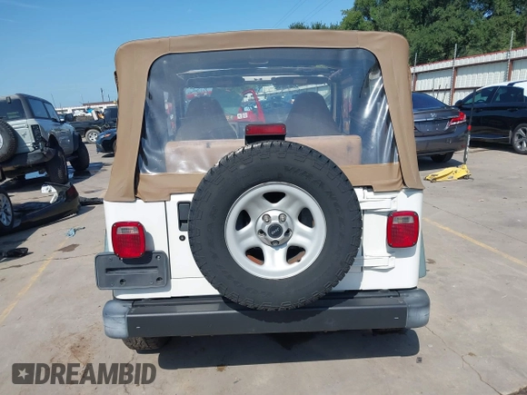 1998 Jeep Wrangler Sport z VIN 1J4FY19S3WP776209, wystawiony jako IAAI lot #42493513 z przebiegiem 113 130 mil mil oraz . Historia ofert i sprzedaży dostępna na DreamBid. Obrazek 16.