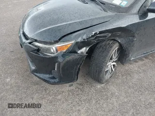 2015 Scion tC with VIN JTKJF5C7XFJ001662, listed as a IAAI auction lot 41843123 with 128,851 mi miles. Bid and sale history available at carsss.com. Image 6.
