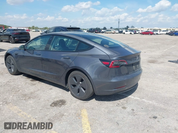 2023 Tesla Model 3 with VIN 5YJ3E1EA3PF623114, listed as a IAAI auction lot 41710385 with 31,663 mi miles and . Bid and sale history available at carsss.com. Image 3.