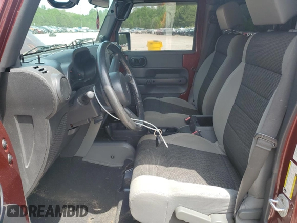 2007 Jeep Wrangler Unlimited X with VIN 1J4GA39187L161451, listed as a Copart auction lot 55280905 with 214,660 mi miles and Salvage Title. Bid and sale history available at DreamBid. Image 7.