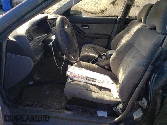 2000 Subaru Legacy L with VIN 4S3BE6353Y7216836, listed as a Copart auction lot 77437624 with Not provided miles and Salvage title. Bid and sale history available at DreamBid. Image 7.