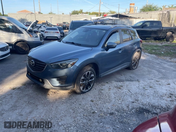 2016 Mazda CX-5 Grand Touring with VIN JM3KE4DY9G0673789, listed as a IAAI auction lot 42196841 with 98,622 mi miles and . Bid and sale history available at DreamBid. Image 2.