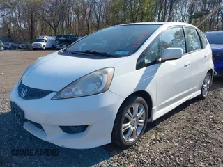 2009 Honda Fit Sport w/Navi with VIN JHMGE88609C002848, listed as a IAAI auction lot 42121403 with 168,138 mi miles. Bid and sale history available at carsss.com. Image 2.