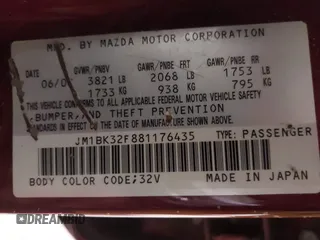 2008 Mazda Mazda3 i Touring Value with VIN JM1BK32F881176435, listed as a IAAI auction lot 41386907 with 156,763 mi miles. Bid and sale history available at carsss.com. Image 9.