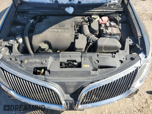 2014 Lincoln MKS z VIN 1LNHL9DK3EG606655, wystawiony jako Copart lot #42008655 z przebiegiem 100 886 mil mil oraz Szkoda całkowita • Salvage title. Historia ofert i sprzedaży dostępna na DreamBid. Obrazek 12.