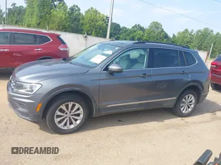 2018 Volkswagen Tiguan SEL z VIN 3VV3B7AX1JM045203, wystawiony jako IAAI lot #42572229 z przebiegiem 104 873 mil mil oraz . Historia ofert i sprzedaży dostępna na DreamBid. Obrazek 14.