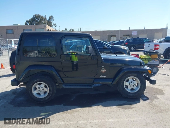 2001 Jeep Wrangler Sahara z VIN 1J4FA59S41P313113, wystawiony jako IAAI lot #42266173 z przebiegiem 125 792 mil mil oraz . Historia ofert i sprzedaży dostępna na DreamBid. Obrazek 13.