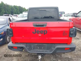 2023 Jeep Gladiator Sport S z VIN 1C6HJTAG4PL544871, wystawiony jako IAAI lot #42382428 z przebiegiem 33 453 mil mil oraz . Historia ofert i sprzedaży dostępna na DreamBid. Obrazek 16.