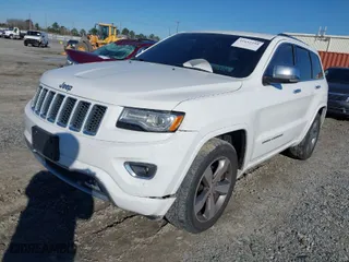 2014 Jeep Grand Cherokee Overland with VIN 1C4RJFCG9EC587322, listed as a IAAI auction lot 41632299 with 161,779 mi miles. Bid and sale history available at carsss.com. Image 6.