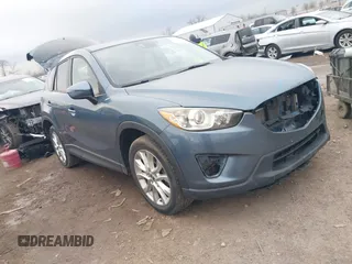 2015 Mazda CX-5 Grand Touring with VIN JM3KE2DY8F0527306, listed as a IAAI auction lot 41849031 with 126,828 mi miles. Bid and sale history available at carsss.com. Image 1.