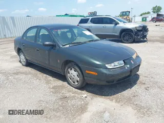 2000 Saturn SL z VIN 1G8ZH5280YZ180615, wystawiony jako IAAI lot #42491523 z przebiegiem 157 550 mil mil oraz . Historia ofert i sprzedaży dostępna na DreamBid. Obrazek 1.