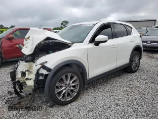 2019 Mazda CX-5 Grand Touring with VIN JM3KFADM6K1581261, listed as a Copart auction lot 59965175 with 127,837 mi miles and Salvage title. Bid and sale history available at DreamBid. Image 1.