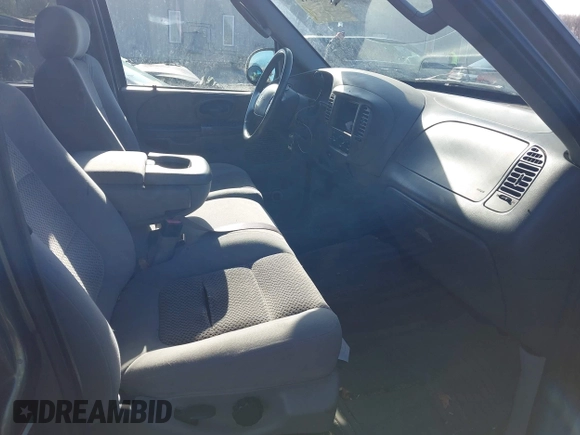 2003 Ford F-150 XLT with VIN 1FTRW07L13KB66977, listed as a IAAI auction lot 41967541 with 124,714 mi miles. Bid and sale history available at carsss.com. Image 5.