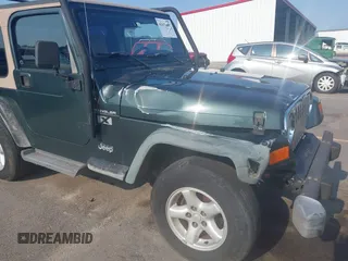 2002 Jeep Wrangler X with VIN 1J4FA39S72P733034, listed as a IAAI auction lot 42659447 with 200,786 mi miles and . Bid and sale history available at DreamBid. Image 6.