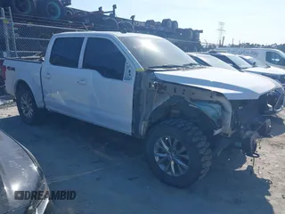 2019 Ford F-150 XL with VIN 1FTEW1E50KFA65574, listed as a IAAI auction lot 42051612 with 98,609 mi miles and . Bid and sale history available at DreamBid. Image 1.