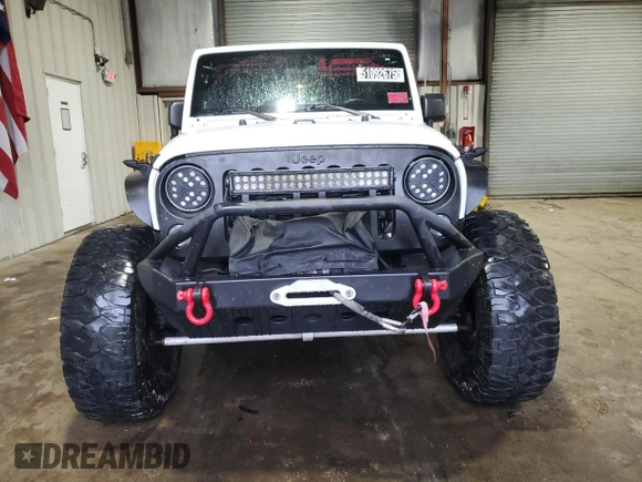2014 Jeep Wrangler Unlimited Sport with VIN 1C4BJWDG4EL125251, listed as a Copart auction lot 51092675 with 76,867 mi miles and Clean Title. Bid and sale history available at carsss.com. Image 5.