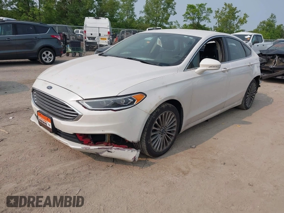 2017 Ford Fusion Titanium z VIN 3FA6P0K92HR396113, wystawiony jako IAAI lot #42402969 z przebiegiem 185 620 mil mil oraz . Historia ofert i sprzedaży dostępna na DreamBid. Obrazek 2.