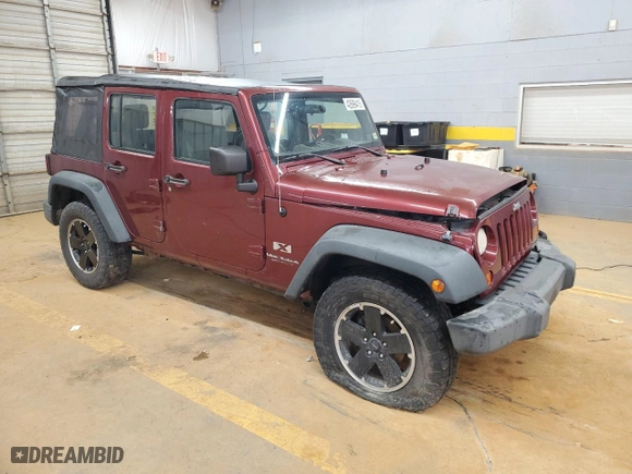 2009 Jeep Wrangler Unlimited X with VIN 1J4GA39149L704314, listed as a Copart auction lot 42699415 with 132,456 mi miles and Salvage Title. Bid and sale history available at carsss.com. Image 4.