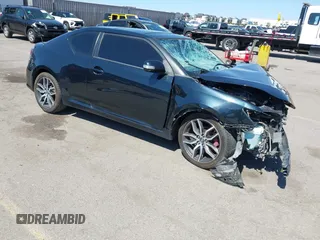 2015 Scion tC with VIN JTKJF5C77F3094936, listed as a IAAI auction lot 41830668 with 89,727 mi miles. Bid and sale history available at carsss.com. Image 1.