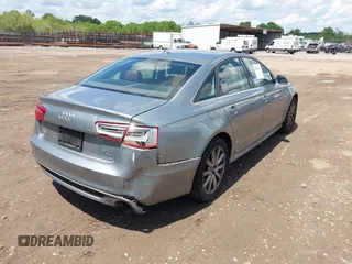 2013 Audi A6 Prestige z VIN WAUHGAFC5DN005495, wystawiony jako IAAI lot #42103621 z przebiegiem 62 268 mil mil oraz . Historia ofert i sprzedaży dostępna na DreamBid. Obrazek 6.