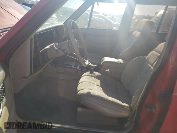 1993 Jeep Cherokee z VIN 1J4FT78S9PL634409, wystawiony jako Copart lot #77034984 z przebiegiem 146 585 mil mil oraz Szkoda całkowita • Salvage title. Historia ofert i sprzedaży dostępna na DreamBid. Obrazek 7.