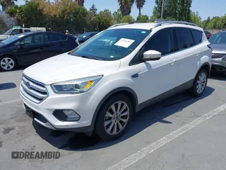 2018 Ford Escape Titanium with VIN 1FMCU0J94JUB26110, listed as a IAAI auction lot 42436285 with 59,586 mi miles and . Bid and sale history available at DreamBid. Image 2.