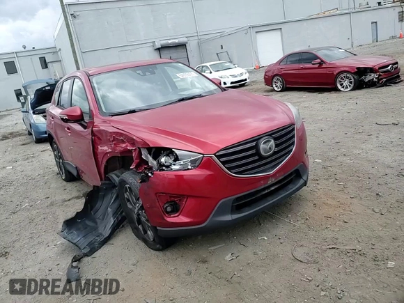 2016 Mazda CX-5 Grand Touring with VIN JM3KE4DY0G0664379, listed as a Copart auction lot 54659005 with 116,022 mi miles and Salvage Title. Bid and sale history available at DreamBid. Image 14.
