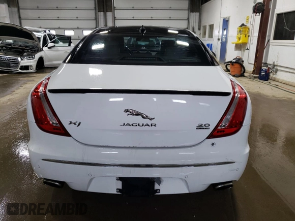 2015 Jaguar XJ with VIN SAJWJ1CD3F8V89374, listed as a Copart auction lot 49416114 with 94,636 mi miles and . Bid and sale history available at DreamBid. Image 6.