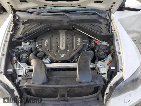 2012 BMW X6 50i z VIN 5UXFG8C59CL590549, wystawiony jako Copart lot #53071175 z przebiegiem 67 390 mil mil oraz Szkoda całkowita • Salvage title. Historia ofert i sprzedaży dostępna na DreamBid. Obrazek 11.