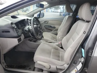 2011 Honda Insight EX with VIN JHMZE2H77BS006079, listed as a Copart auction lot 63873985 with 134,159 mi miles and Salvage title. Bid and sale history available at DreamBid. Image 7.