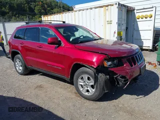 2014 Jeep Grand Cherokee Laredo with VIN 1C4RJFAG8EC262292, listed as a IAAI auction lot 40568162 with 124,871 mi miles and . Bid and sale history available at DreamBid. Image 1.